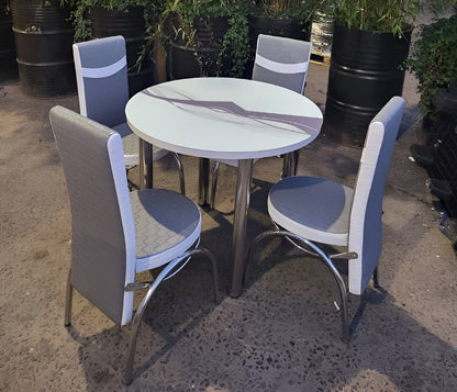 Round Glass And Steel Dining Table With 4 Faux Leather Chairs